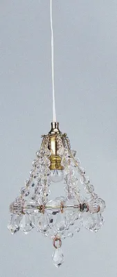 A close-up shot of a miniature chandelier with crystal beads and a brass fixture, hanging from a white cord against a light gray background.