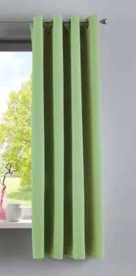 A green curtain hangs in front of a window with trees visible outside.