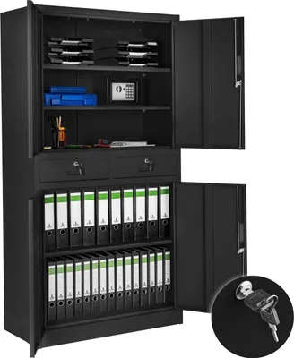 An open black metal filing cabinet filled with binders and a small safe.