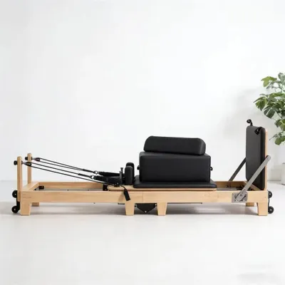 Produktbild von Pilates Reformer aus Ahornholz - Reformer-Bett - Klappbar - Verstellbarer Widerstand - Platzsparend - Max. Belastung 500 kg - Schwarz