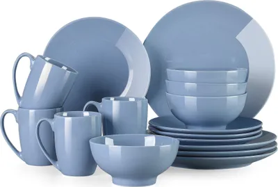 A set of blue ceramic dishes including plates, bowls, and mugs, arranged on a white background.