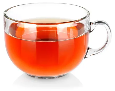 A clear glass mug filled with a red beverage.