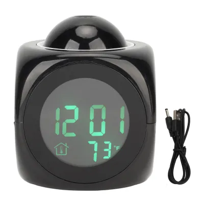 A black digital alarm clock with a projection dome on top and a USB cable next to it, set against a white background.