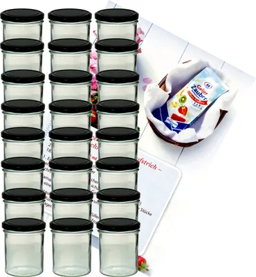 A set of glass jars with black lids, arranged in columns, with a small basket containing a packet of jelly powder in the background.