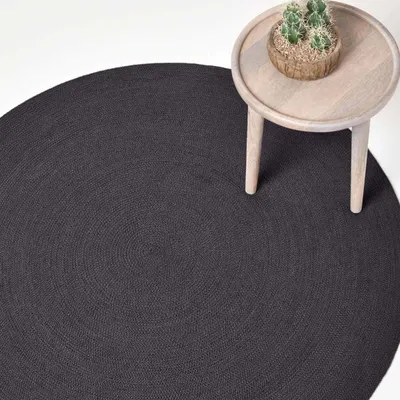Produktbild von HOMESCAPES Handgewebter geflochtener Teppich in Schwarz, 150 cm rund