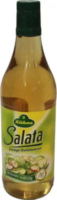 A bottle of salad dressing on a white background.