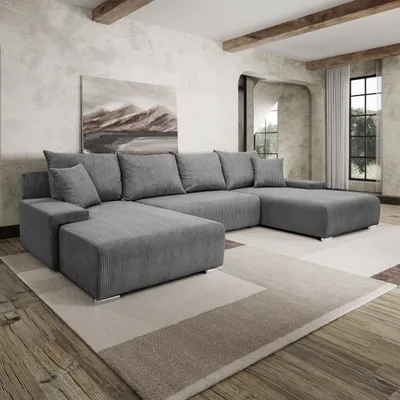 A modern living room with a large U-shaped sofa, a painting on the wall, and wooden beams on the ceiling.