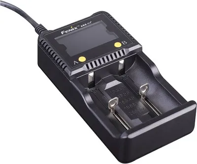 A black Fenix ARE-C1+ battery charger is shown on a white background.