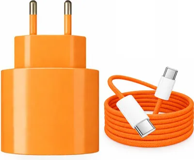 A product shot of an orange USB-C charger and a coiled orange USB-C cable against a white background.