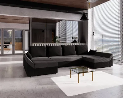 A modern living room with a large U-shaped sofa, a coffee table, and blinds covering a large window.