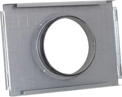 A close-up, straight-on view of a metal ventilation component with a circular opening.