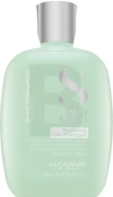 A product shot of a green shampoo bottle with a silver cap.