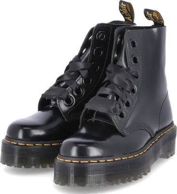 A pair of black Dr. Martens platform lace-up boots.