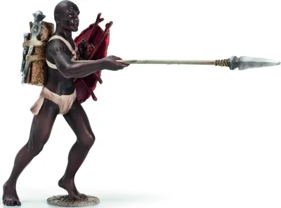 A figurine of an African warrior holding a spear and shield.