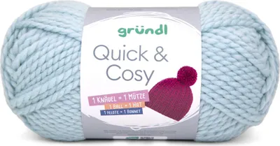 A ball of light blue yarn with a label showing the brand and product name, along with an illustration of a knitted hat.