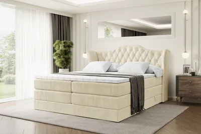 A bedroom scene with a large bed as the focal point.