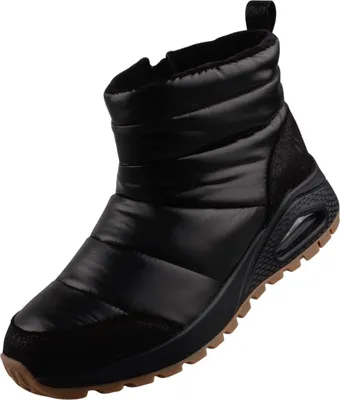A black puffer boot with a brown sole.