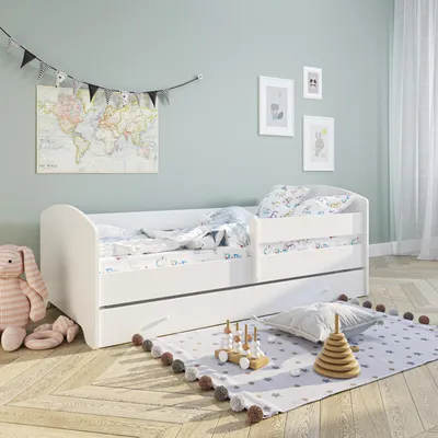 A child's bedroom with a white bed, toys, and decorations.