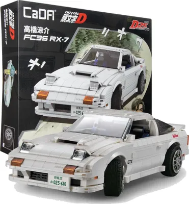 A white building block model of a Mazda FC3S RX-7 car is displayed in front of its packaging box.