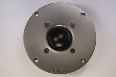 A top-down view of a speaker tweeter on a white background.