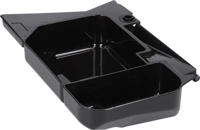 A black plastic drip tray for a coffee machine.