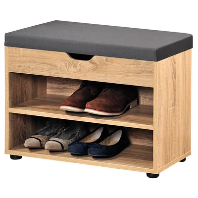 A shoe cabinet with a cushioned top and two shelves for shoes, with a drawer above the shelves.
