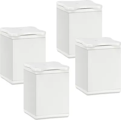 Four white cube-shaped furniture feet with rounded tops are arranged in a staggered formation against a white background.