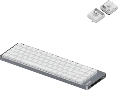 A silver and white Lofree Flow 2 68 mechanical keyboard is shown on a white background. Two small white components, possibly keycaps or switches, are visible in the upper right corner.