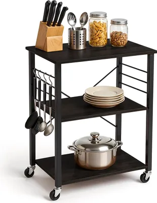 A kitchen cart with various kitchen items on it.