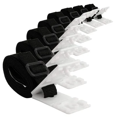 A set of black straps with white plastic clips, arranged diagonally on a white background.