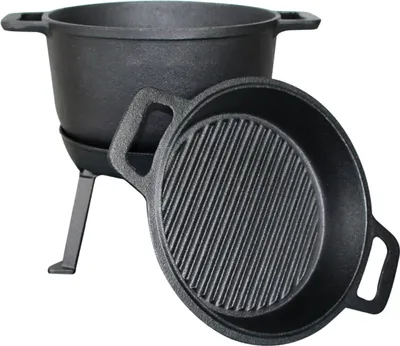 A black cast iron Dutch oven with a grill pan and stand, shown against a white background.