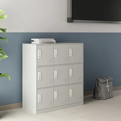 A set of gray lockers in a hallway setting with a backpack and books.