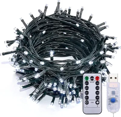 A coiled string of white LED lights with a remote control and USB connector.