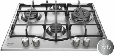 A stainless steel gas hob with four burners and control knobs in the foreground.