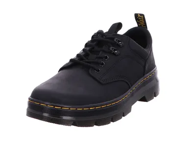 A black Dr. Martens shoe is shown against a white background.