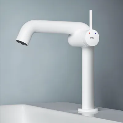 A white faucet is shown on a white sink against a light blue background.