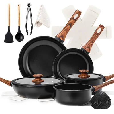 A collection of cookware and utensils arranged on a white background.