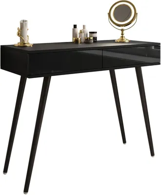 A black console table with gold accents and decorative items on top.