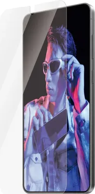 A person is shown adjusting their sunglasses while holding a phone, with a screen protector overlaid on the phone's screen.