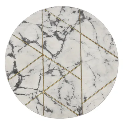 A round rug with a marble pattern and geometric gold lines.