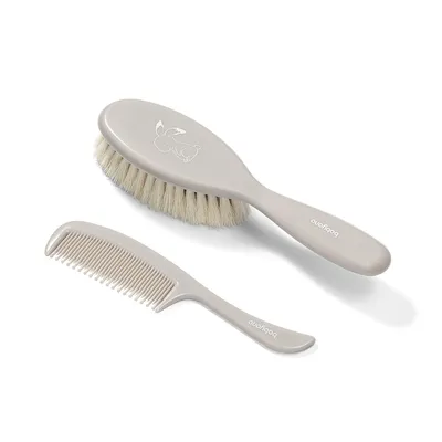A baby brush and comb set on a white background.