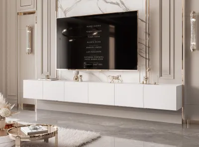 A modern living room with a wall-mounted TV and entertainment unit.