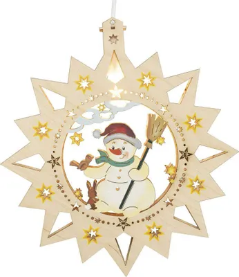 A wooden Christmas ornament featuring a snowman with a broom, a bird, and a rabbit, set against a starry sky background.