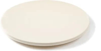 A plain white background with a round, flat object.