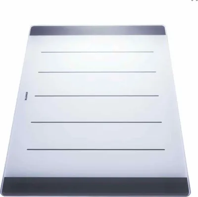 A glass cutting board with horizontal lines on a white background.