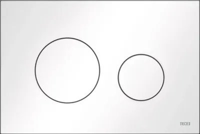 A white rectangular plate with two circular buttons, one larger than the other, and a small logo in the bottom right corner.