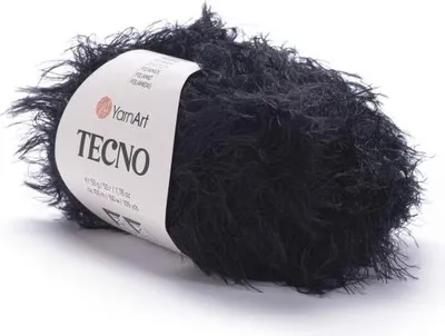 A ball of black, fluffy yarn with a label.