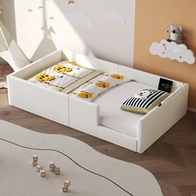 A child's bedroom with a white bed, bedding with a giraffe pattern, and decorative wall elements.