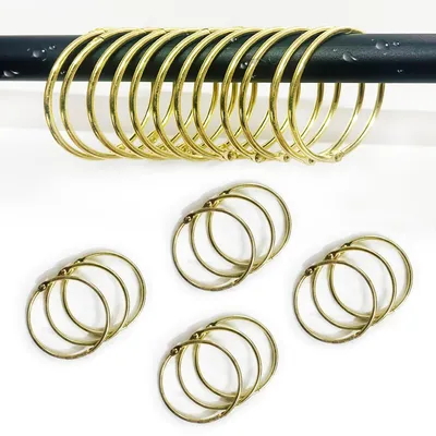 Imagen del producto de Anillos para cortina de ducha, metálicos, redondos, de 50 mm, paquete de 12 unidades, para baño