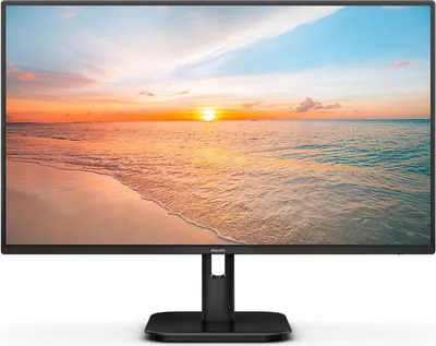 A black Philips monitor displaying a sunset over the ocean.